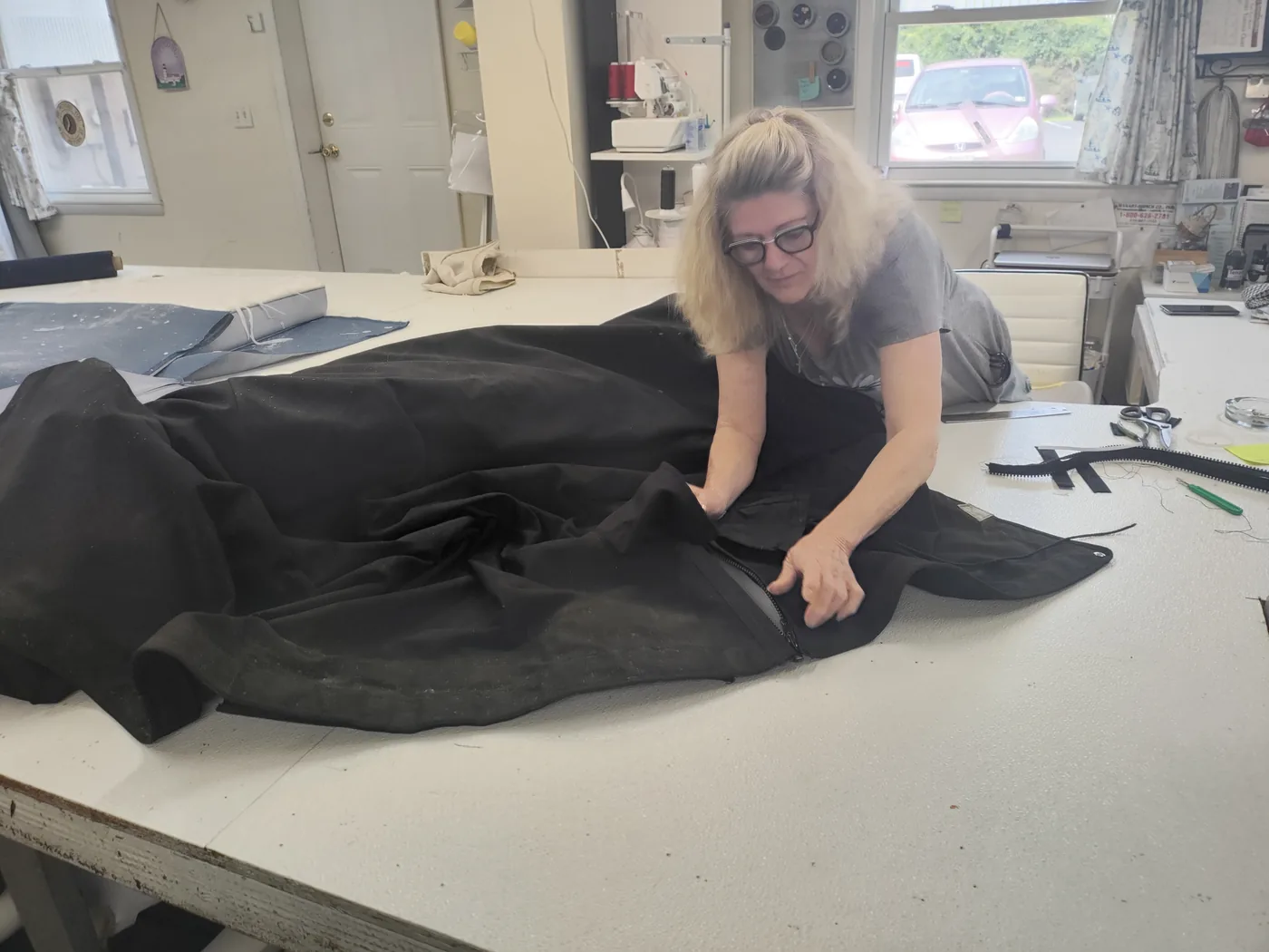 Joyce working on a sewing project